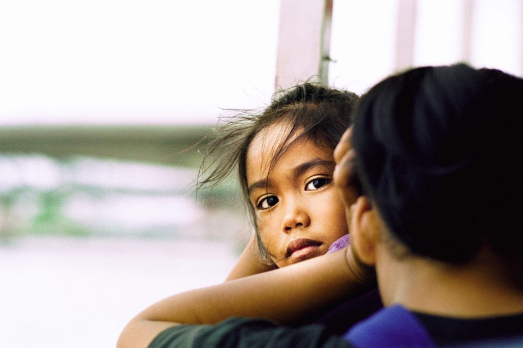 THAILAND. A girl traveling with her mother across the Chao Praya river. One of Martin Edström's top 10 images.